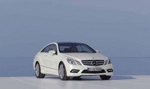 All new Mercedes-Benz vehicles, including the 2010 E-Class, will be equipped with the mbrace system.  You supply the iPhone.