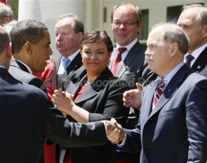 President Barack Obama and President Barack Obama shakes hands with GM President Fritz Henderson, AP Photo/Charles Dharapak