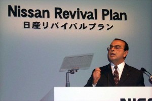 Nissan is reporting its first loss in a decade -- a setback for CEO Carlos Ghosn, who is shown here announcing the Nissan Revival Plan, in October 1999.