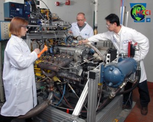 Members of the GM's HCCI team preparing a prototype engine for testing.