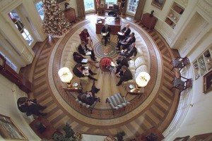 President George W. Bush meeting with his advisers in the Oval Office.