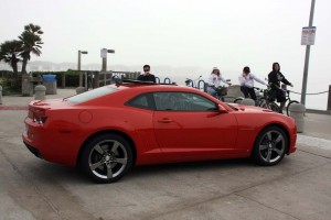 California Dreamin'? Potential buyers check out the 2010 Chevrolet Camaro, parked here by a San Diego beach.