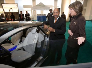 Carol Browner (right) director of the Office of Energy and Climate Change listens as General Motors Vice President Global Design Ed Welburn gives her a tour of the Cadillac Converj electric luxury coupe.