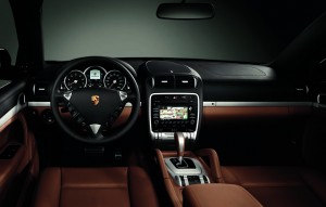 The navigation screen and the central display between the speedo and tach do double-duty, indicating the performance mode of the hybrid drive system.