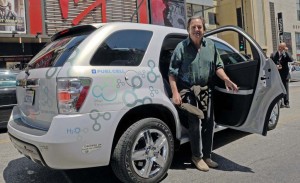 Actor Bo Bridges tries out a hydrogen-powered Chevrolet Equinox. The latest GM fuel cell "stack" is lighter, smaller and far less expensive.