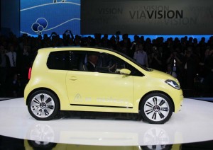 Should the industry focus on high-end electric vehicles, where consumers can afford the premium for the technology, or start with mini-EVs, like this Volkswagen e-Up prototype?