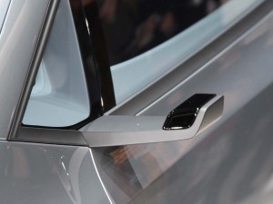 The VW Up! Lite concept makes extensive use of aerodynamics to improve fuel economy, replacing conventional mirrors with these "winglets" containing rearview cameras.